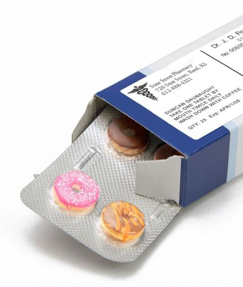 Image of a pills blister getting out form the box over white background with shadow.